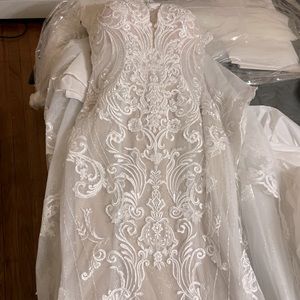 Brand new Klienfield wedding dress never worn and altered.